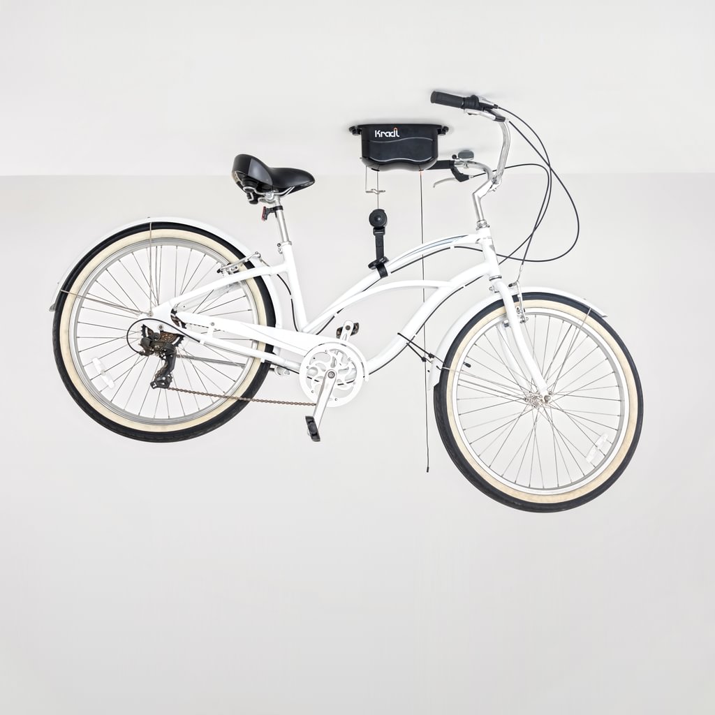 White beach cruiser bike hanging from Kradl