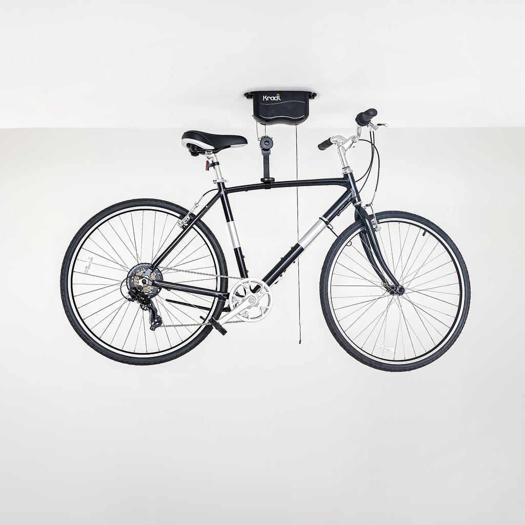 Black hybrid bike hanging from Kradl