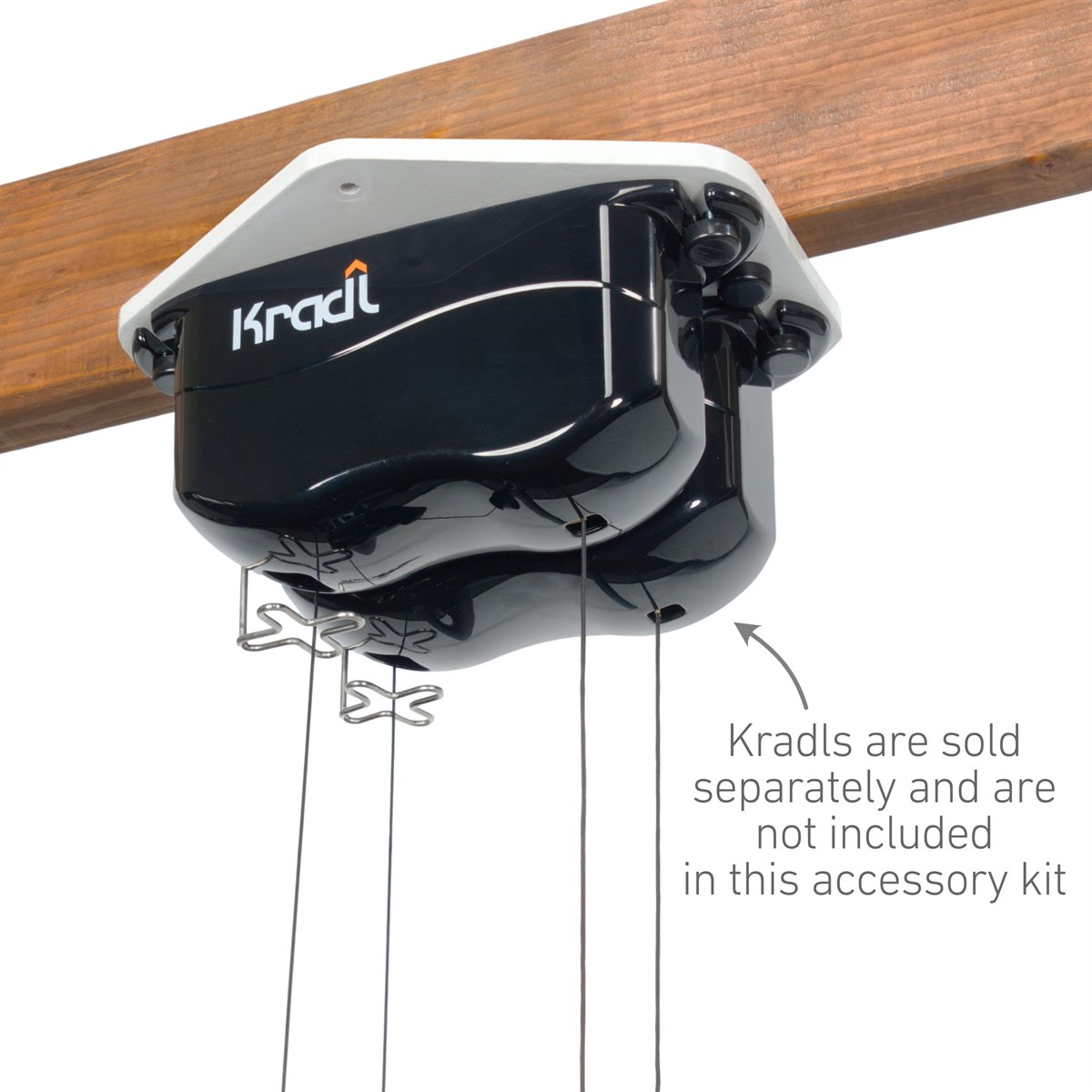 Kradl E-bike Kit components laid out on a white background, including a white hexagonal mounting plate, black straps, and hardware.